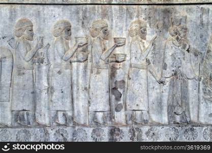 Bas-relief with ceremony on the wall of palace in Persepolis, Iran