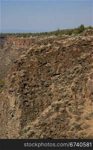 Basalt cliffs and talus from ancient lava flow, Crooked River Canyon, Central Oregon