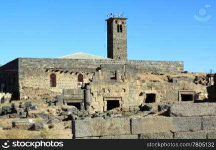 Basalt stone minaret of mosque in Bosra, Syria