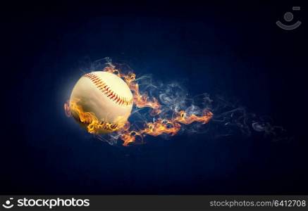 Baseball game concept with ball in fire flames. Mixed media. Ball burning in fire