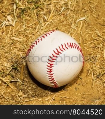 Baseball in the dirt, dry field, square image