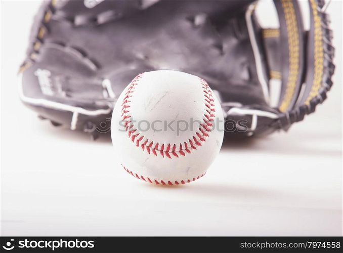 Baseball with glove on the back, white background