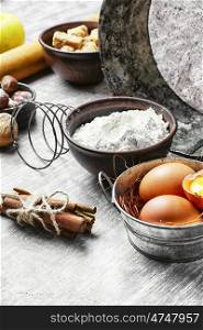 Basic baking ingredients for cooking.Eggs,brown sugar and wheat flour.