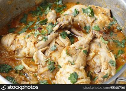 Basic balti chicken, freshly prepared and ready to serve, in a saucepan.