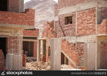 basic brick construction of house in North Africa with window frames set