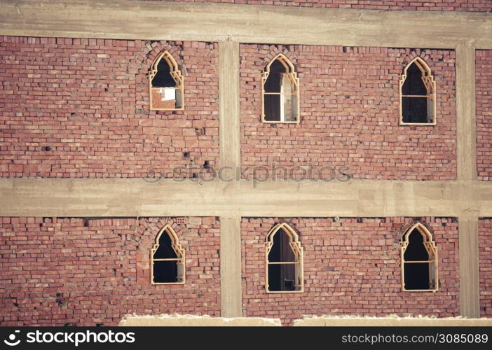 basic brick construction of house in North africa with window frames set