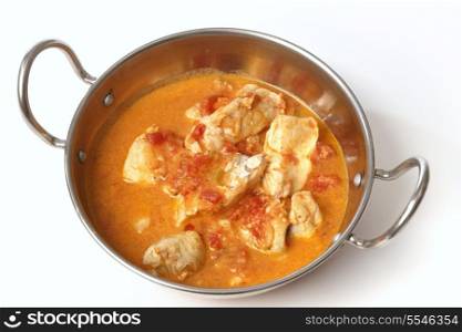 Basic fish curry, in a spicy tomato and coconut milk sauce, in a kadai (karahi or wok) serving bowl