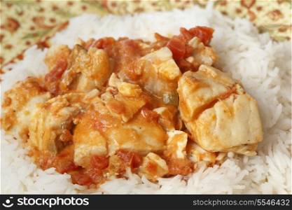 Basic fish curry, in a spicy tomato and coconut milk sauce, served on a bed of basmati rice.