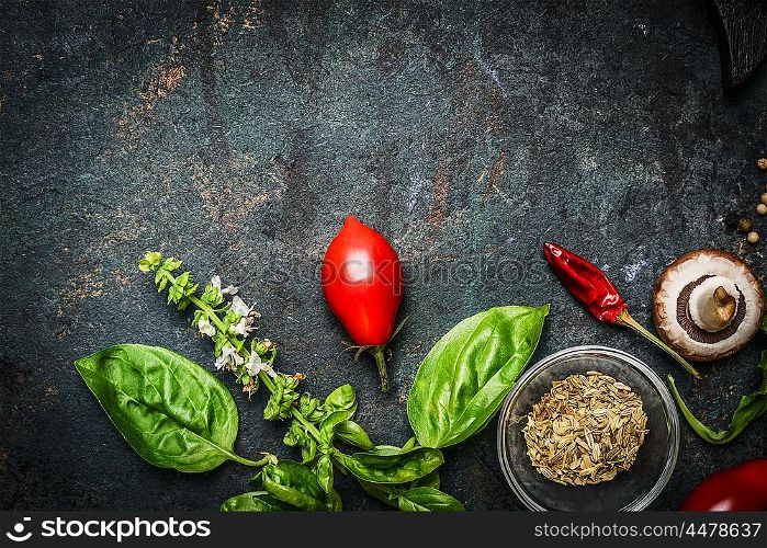 Basil and Tomatoes in rustic wooden background, ingredients for cooking or salad making, top view