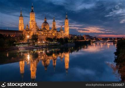 Basilica of our Lady of the Pillar and Ebro river in the evening, Zaragoza, Aragon, Spain.