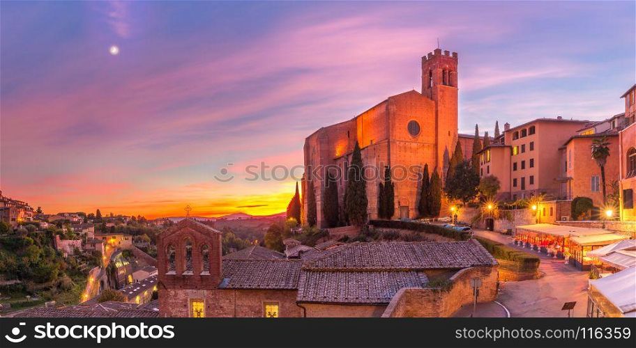 Basilica of San Domenico at sunset, Siena, Italy. Beautiful panoramic view of Basilica of San Domenico, also known as Basilica Cateriniana, in medieval city of Siena at gorgeous sunset, Tuscany, Italy