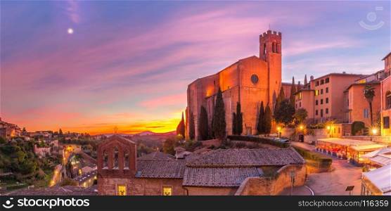 Basilica of San Domenico at sunset, Siena, Italy. Beautiful panoramic view of Basilica of San Domenico, also known as Basilica Cateriniana, in medieval city of Siena at gorgeous sunset, Tuscany, Italy