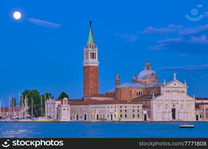Basilica San Giorgio Maggiore Church seen across the Venice lagoon with full moon. Venice, Italy. San Giorgio Maggiore Church with full moon. Venice, Italy