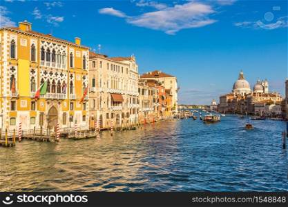 Basilica Santa Maria della Salute and Grand Canal in Venice in a beautiful summer day in Italy