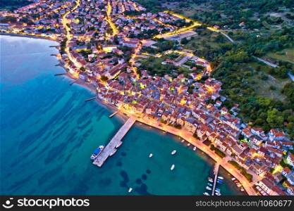 Baska. Aerial evening view of town of Baska coast and harbor. Island of Krk in Croatia.