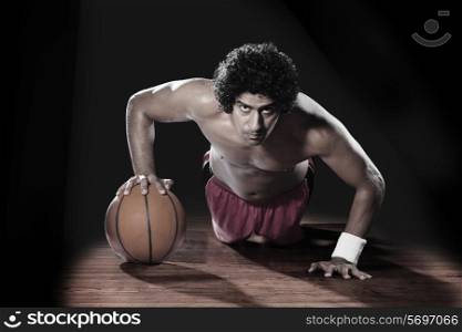 Basket ball player doing push-ups
