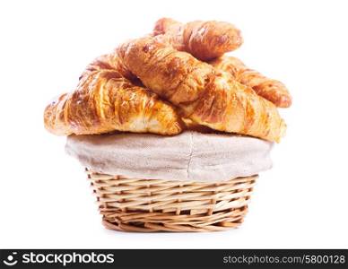 basket of croissants on white background