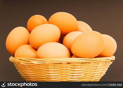 Basket of eggs on the colourful background