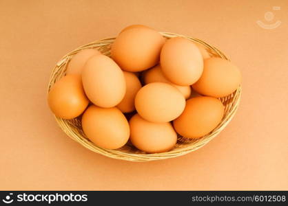 Basket of eggs on the colourful background