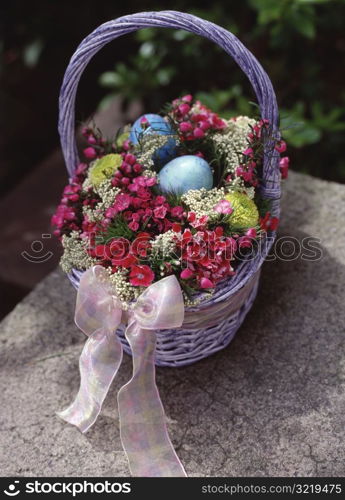 Basket of Flowers and Easter Eggs