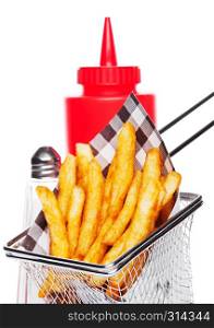 Basket of freshly made southern fries with ketchup and salt black paper on white studio background