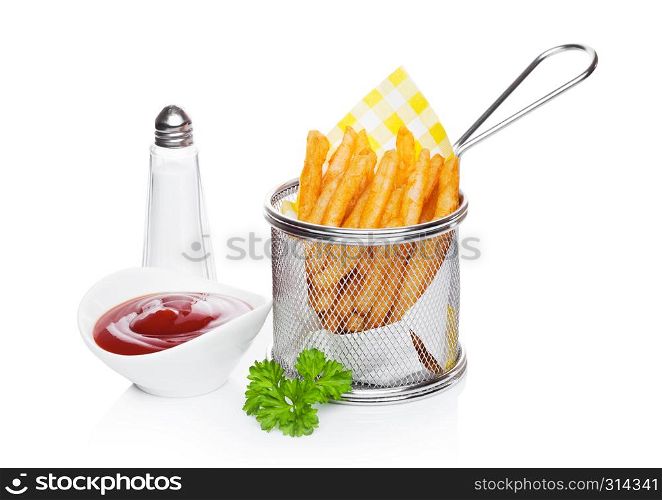 Basket of freshly made southern fries with ketchup and salt yellow paper on white studio background
