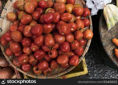 Basket of Tomatoes for sale at market stall, Luang Prabang, Laos