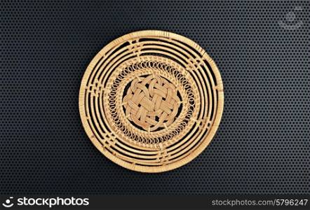 Basket wicker is handmade on a dark background
