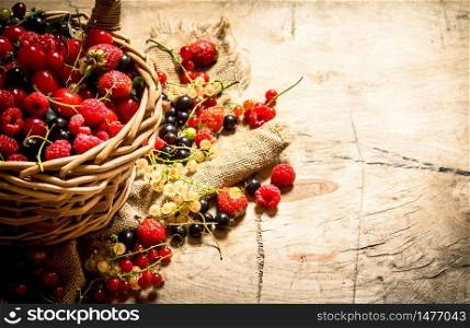 Basket with berries. On a wooden table.. Basket with berries. On wooden table.