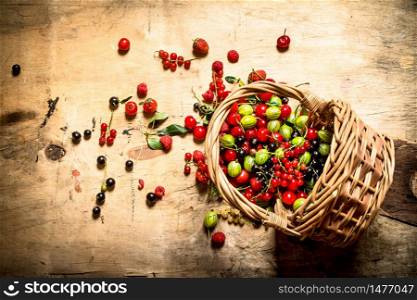 Basket with berries. On a wooden table.. Basket with berries. On wooden table.
