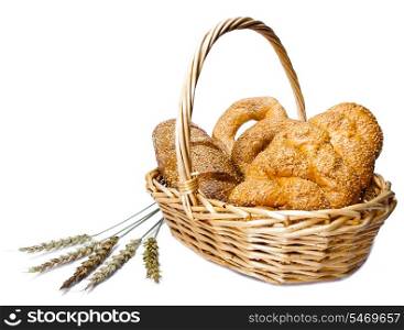 Basket with bread on white background