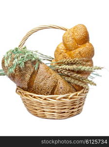 Basket with bread on white background