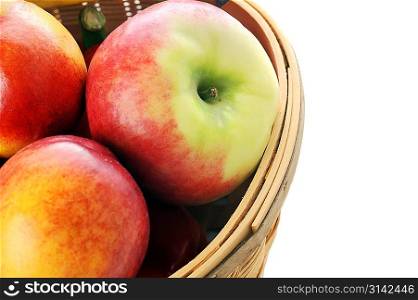 basket with different fruits on white background