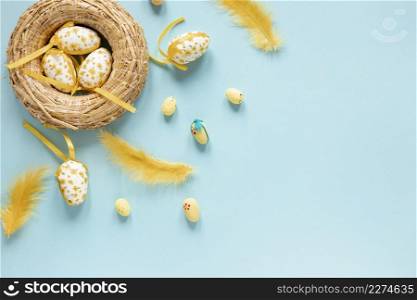 basket with eggs feathers beside