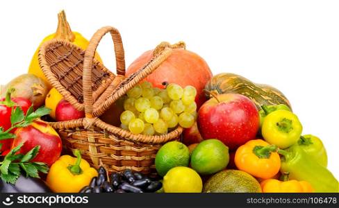 Basket with fresh fruits and vegetables isolated on a white background. Top view.