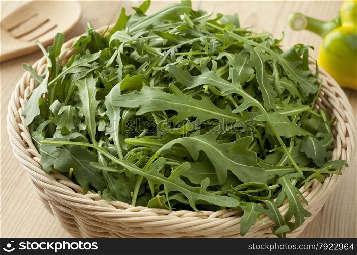 Basket with fresh raw arucola salad