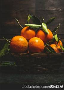 Basket with Fresh tangerines , side view