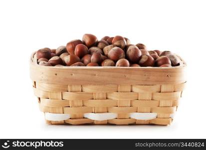 basket with hazelnuts isolated on white background