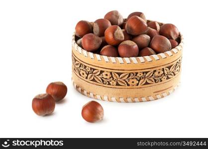 basket with hazelnuts isolated on white background