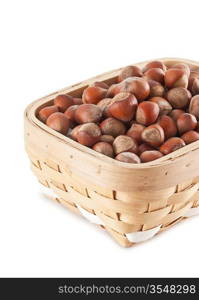 basket with hazelnuts isolated on white background