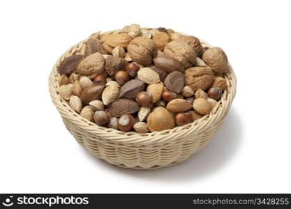 Basket with mixed nuts on white background