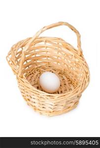Basket with one egg isolated on white