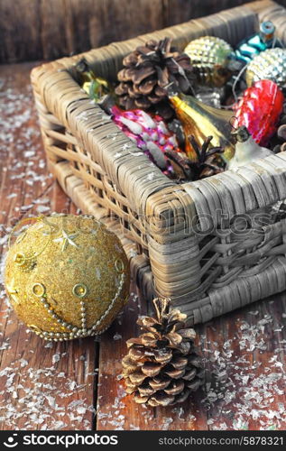 Basket with ornaments on the Christmas tree. Christmas ornaments in wooden wicker box.Photo tinted.