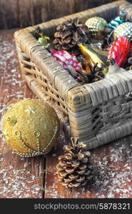 Basket with ornaments on the Christmas tree. Christmas ornaments in wooden wicker box.Photo tinted.