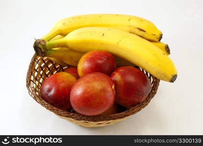 Basket with peaches and bananas