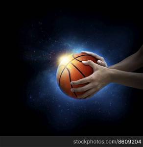 basketball ball in man&rsquo;s hand. basketball game concept