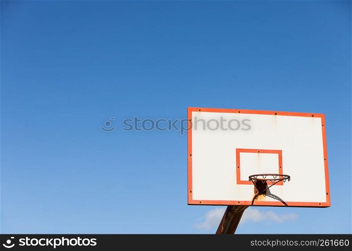 basketball board with basket hoop against blue sky. Sport, recreation.. basketball basket against blue sky