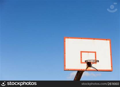 basketball board with basket hoop against blue sky. Sport, recreation.. basketball basket against blue sky