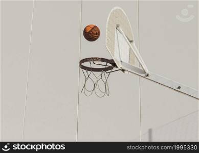 basketball falling hoop against wall