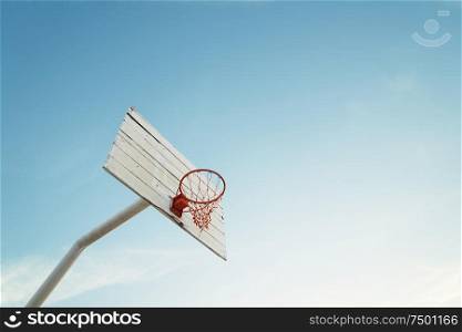 Basketball hoop on empty outdoor court